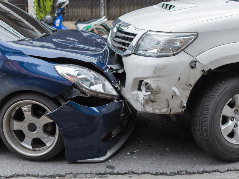 head on collision between a car and a truck
