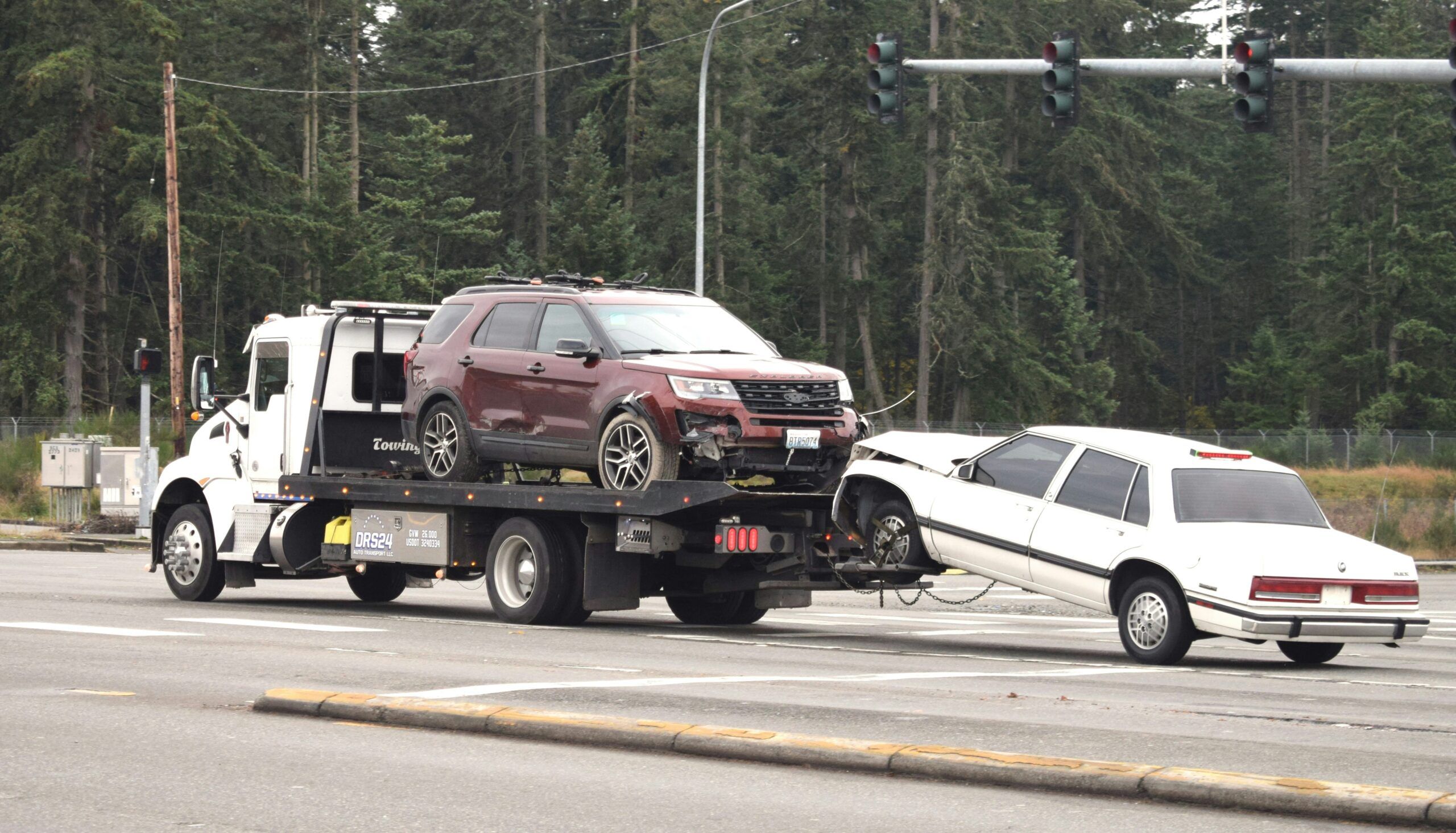 two cars being towed