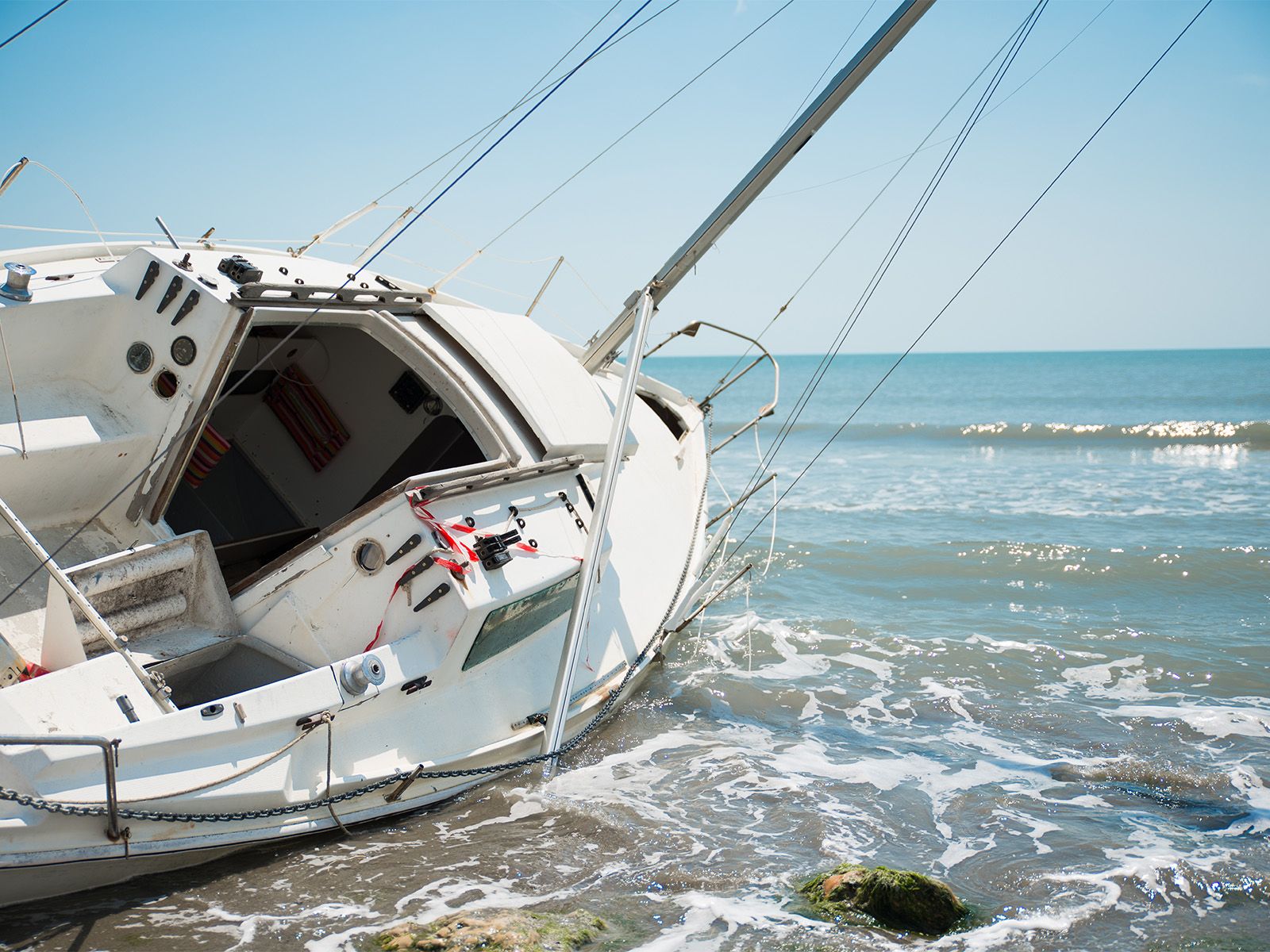 sailboat wrecked on shore