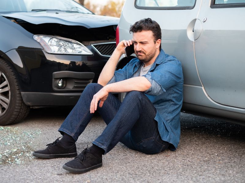 Man on the phone after an auto accident