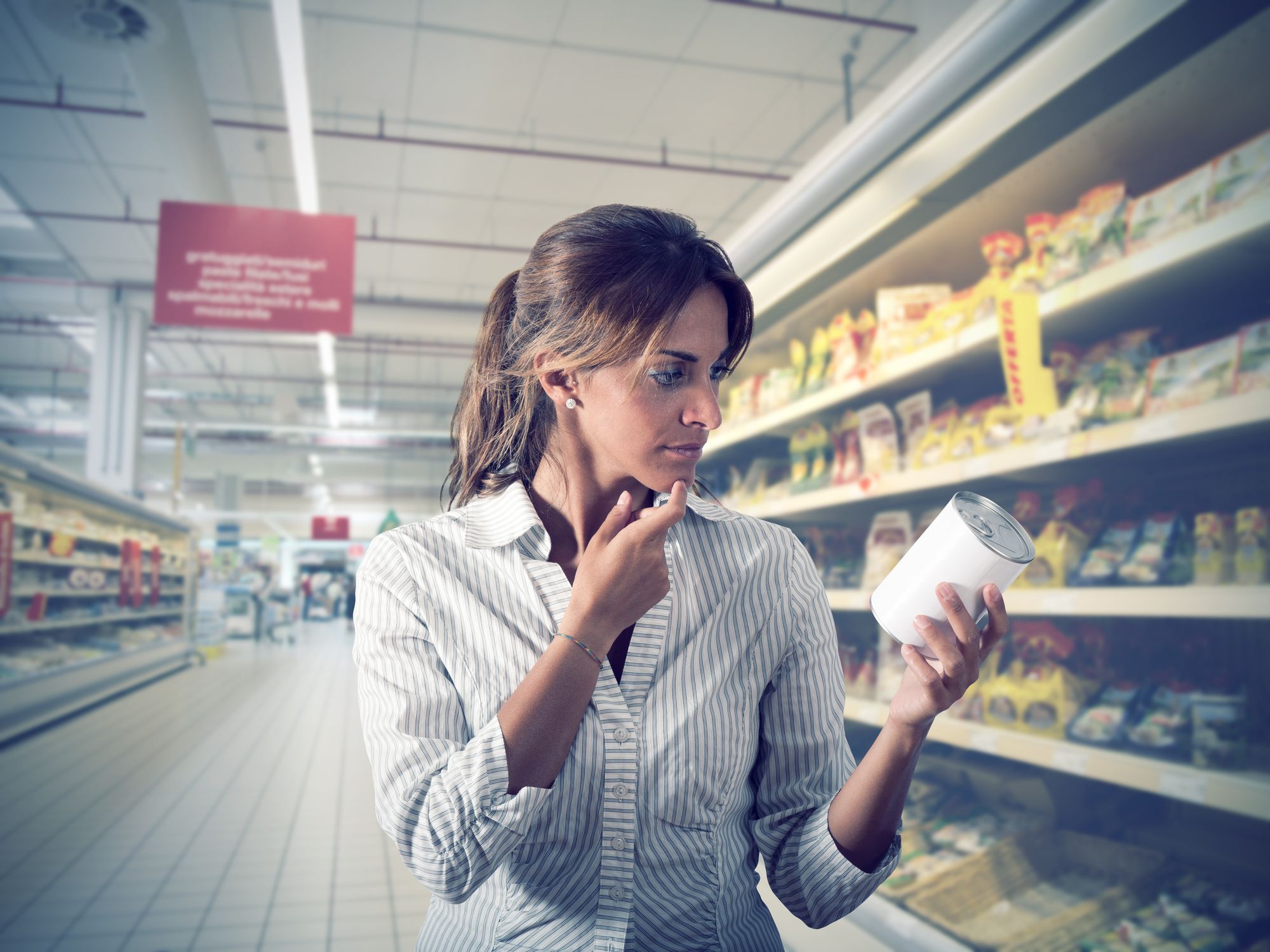 Girl unsure of the product at supermarket