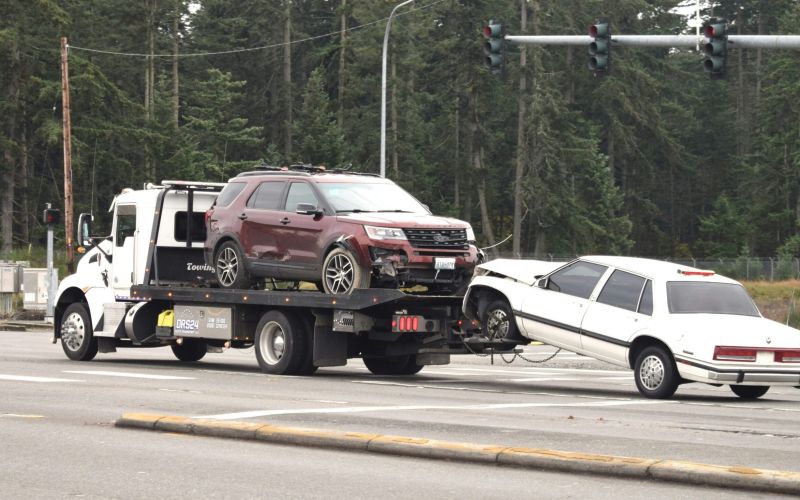 two cars being towed