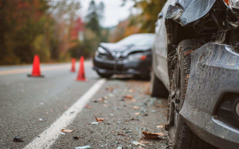 Close up of the crumpled front bumper of a passenger car