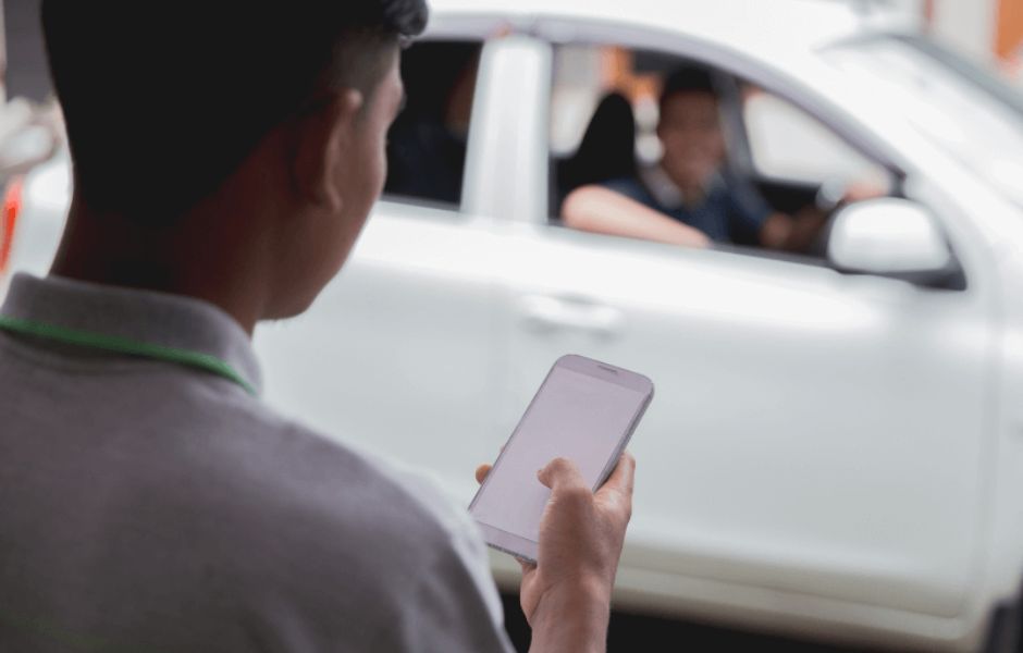 Man ordering an uber on his phone