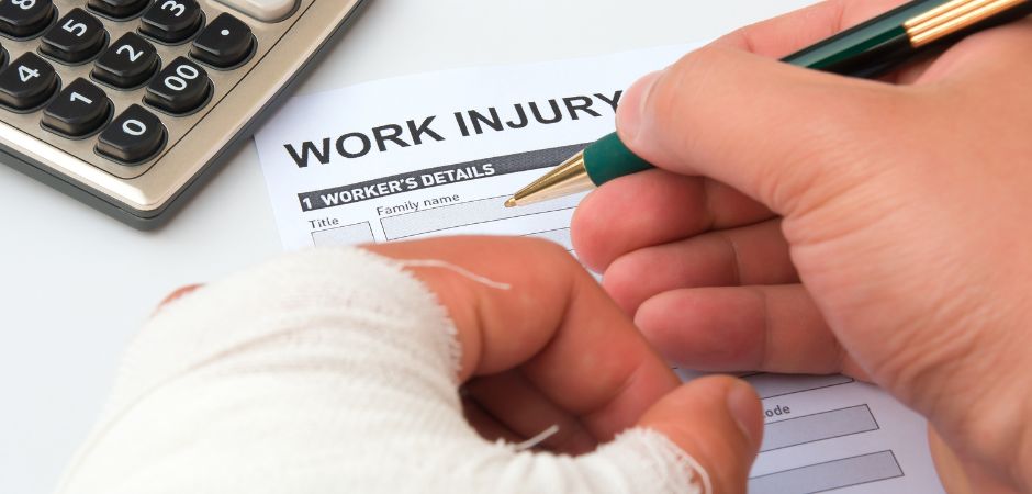 Person in an arm cast filing a workers compensation form