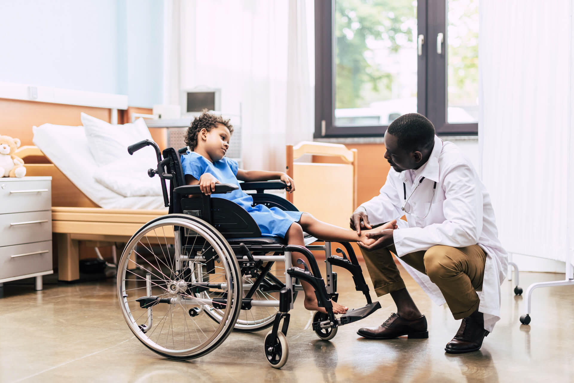 Doctor comforts a child with injury