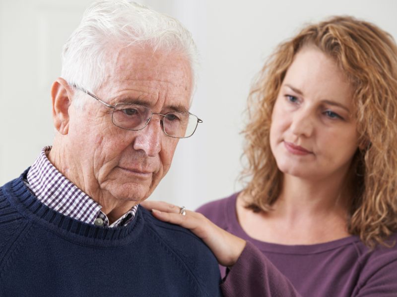 Elderly man looking upset