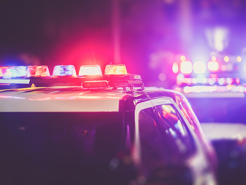 police car with its roof lights on