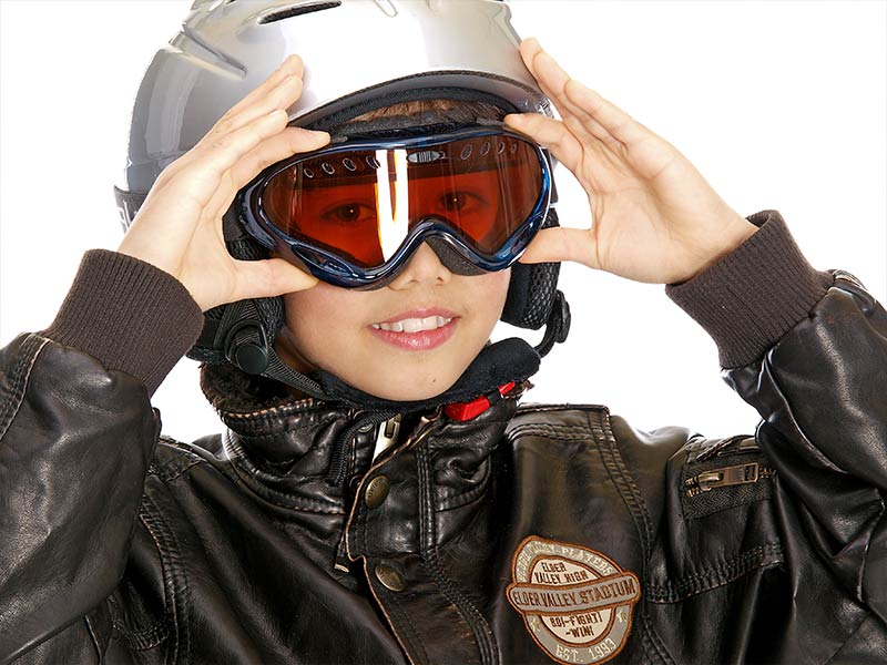 A child wearing motorcycle safety equipment