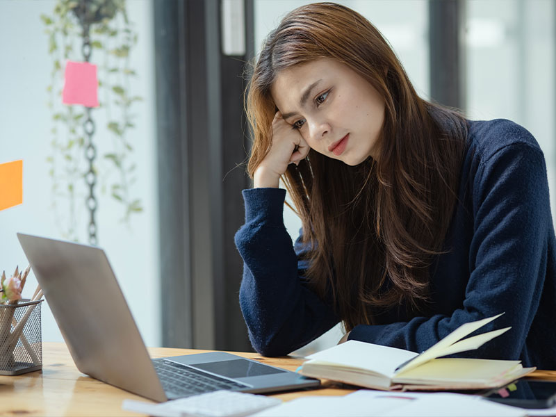 woman looking at her laptop 