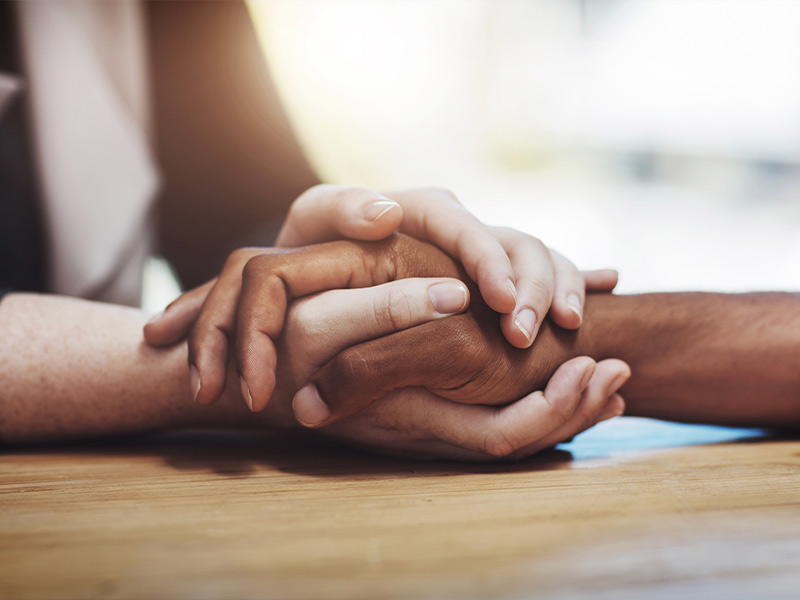 a woman holding hands with a man 