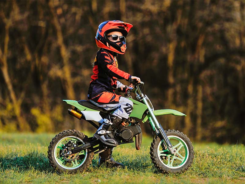 a child riding a minitature dirtbike