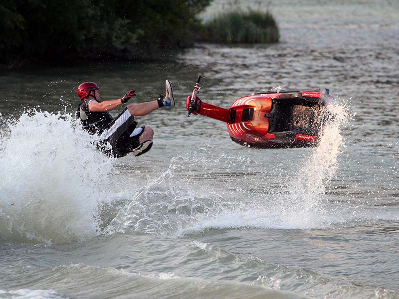 man falling off his jet ski