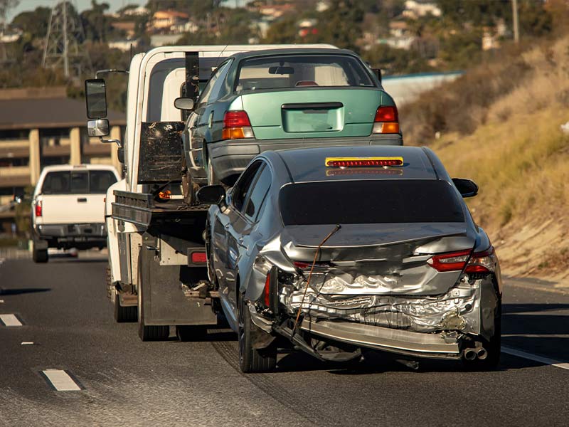 a car being pulled by a tow truck