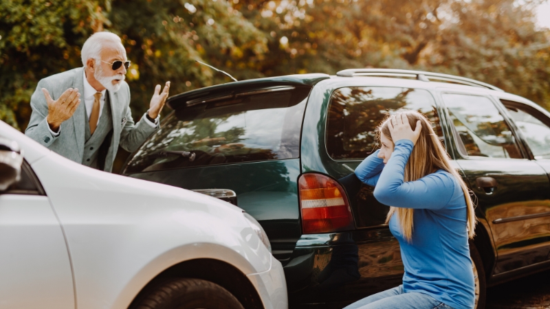man yelling at woman after a fender bender