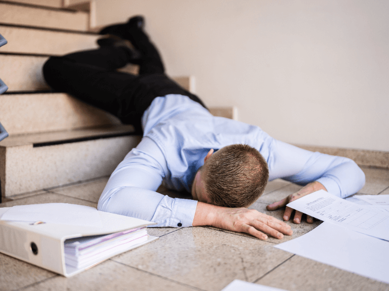 man slipping and falling down stairs