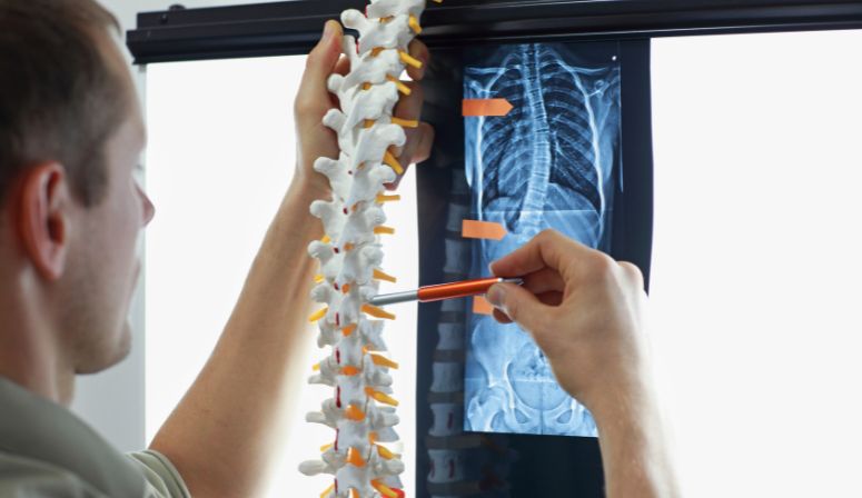 man looking at spine
